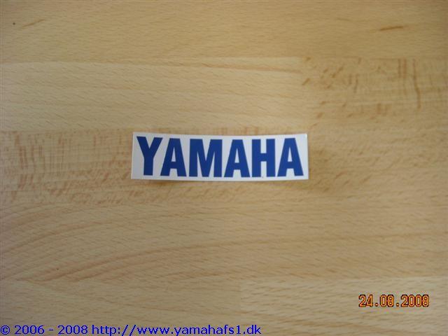 Blå Yamaha mærke for originalt anderøvssæde
